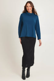 Model Madeline wearing size 10 of the Knit Core Skirt in colour Black (Black), from the front, showing the whole outfit