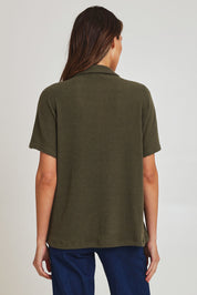 Model Madeline wearing size 10 of the Vesty Top in colour Khaki (Green), from the back