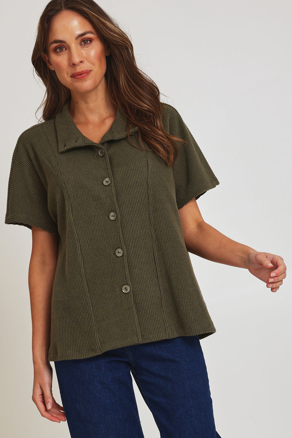 Model Madeline wearing size 10 of the Vesty Top in colour Khaki (Green), from the front, showing the whole outfit
