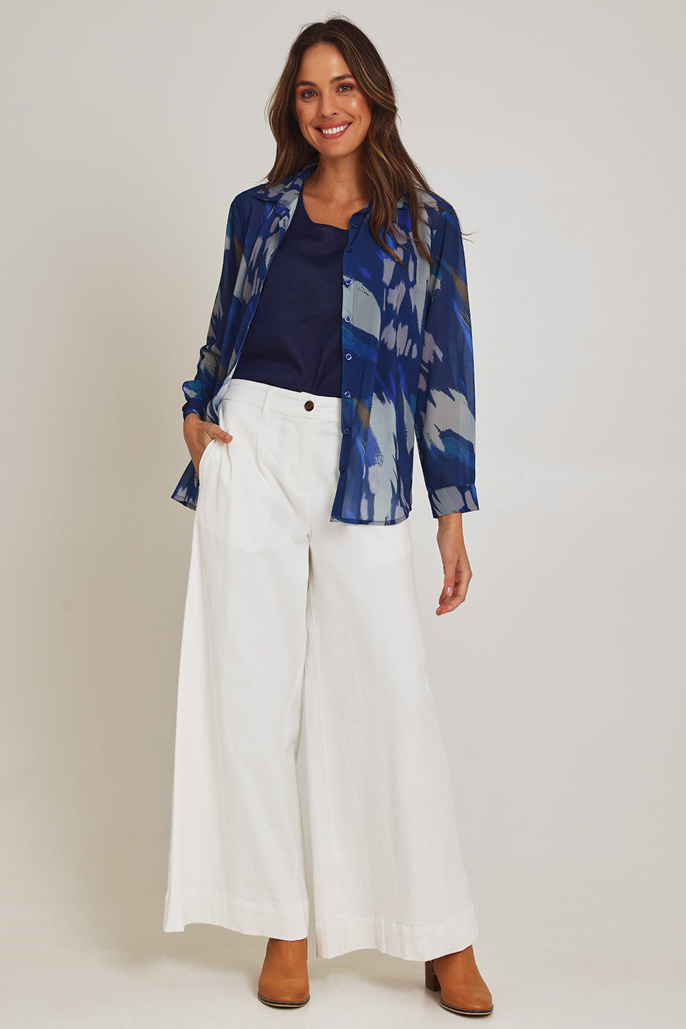 Model Madeline wearing size 10 of the Abstract Shirt in colour Blueprint (Blue), from the front, showing the whole outfit