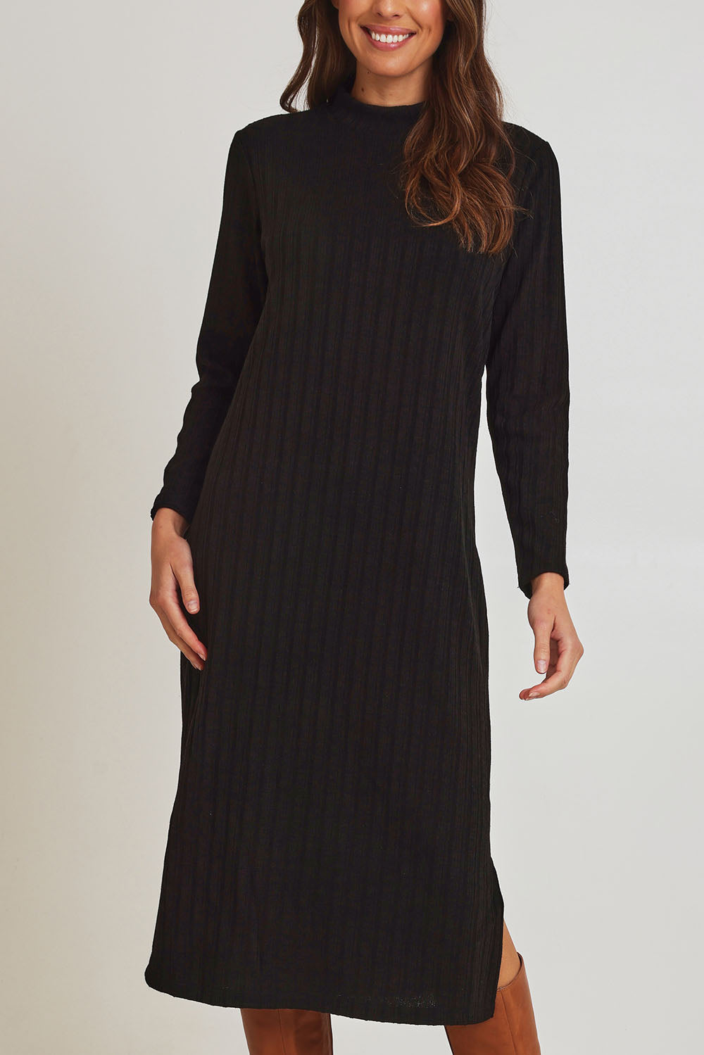 Model Madeline wearing size 10 of the Rib Dress in colour Black (Black), from the front, cropped image