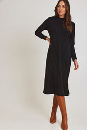 Model Madeline wearing size 10 of the Rib Dress in colour Black (Black), from the front, showing the whole outfit
