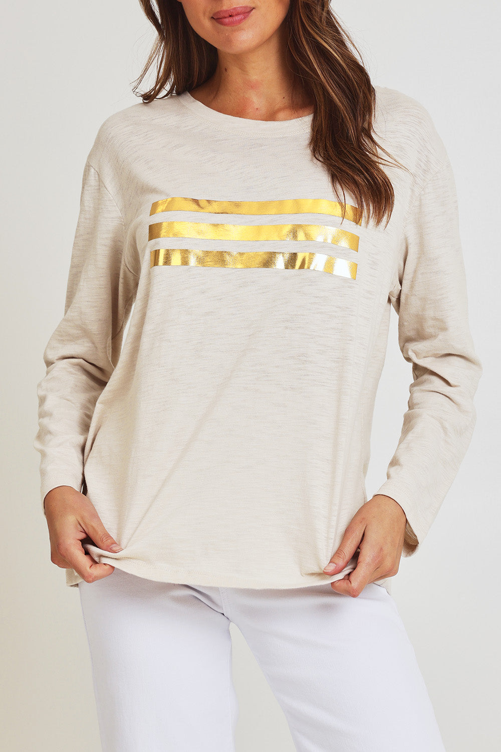 Model Madeline wearing size 10 of the Foiling Around Cotton Tee in colour Oatmeal, from the front, cropped image