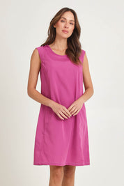 Model Madeline wearing size 10 of the Get Smart Cotton Blend Dress in colour Berry (Pink), from the front, cropped image
