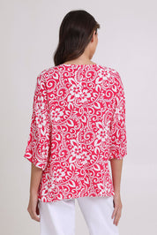 Model Madeline wearing size 10 of the Summer Ease Top in colour Raspberry (Pink), from the back