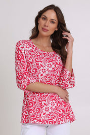 Model Madeline wearing size 10 of the Summer Ease Top in colour Raspberry (Pink), from the front, cropped image