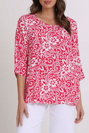 Model Madeline wearing size 10 of the Summer Ease Top in colour Raspberry (Pink), from the front, cropped image