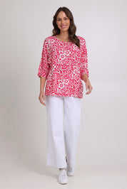 Model Madeline wearing size 10 of the Summer Ease Top in colour Raspberry (Pink), from the front, showing the whole outfit