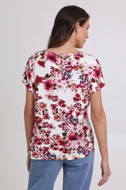 Model Madeline wearing size 10 of the Perfect Vee Tee in colour Floral (Pink), from the back