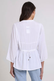 Model Madeline wearing size 10 of the Bombay Beauty Top in colour White (White), from the back