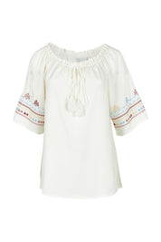 Product shot of the Oakley Embroidered Top in colour Ivory (White), from the front