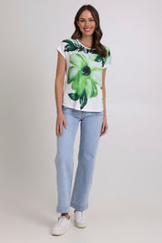 Model Madeline wearing size 10 of the Green Goddess Scoop Tee in colour Green (Green), from the front, showing the whole outfit