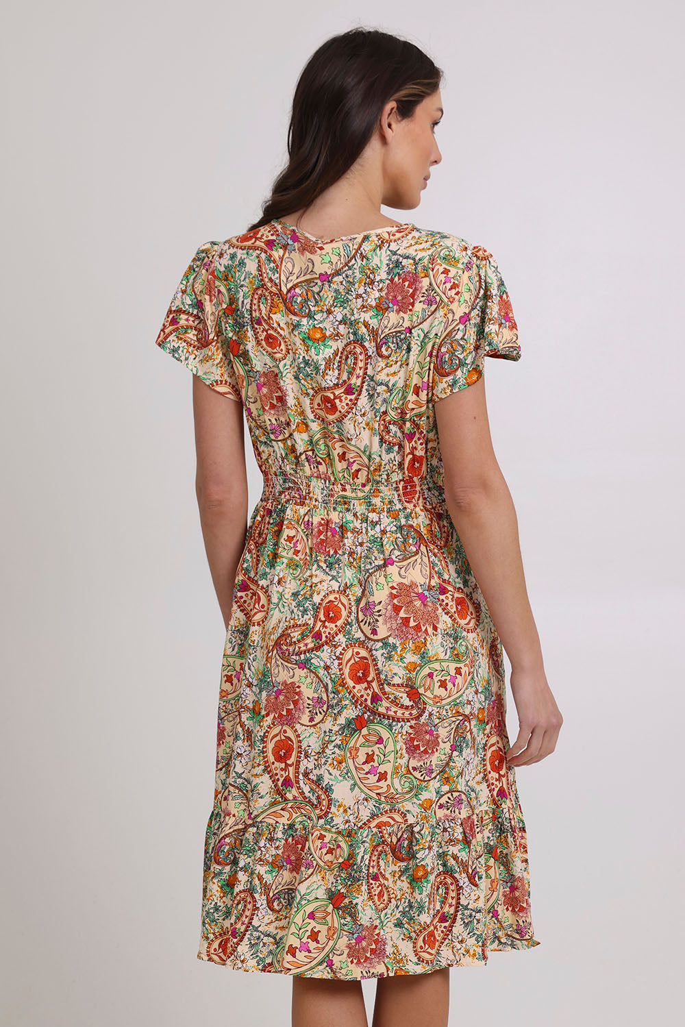 Model Madeline wearing size 10 of the Kiara Pocket Dress in colour Floral, from the back