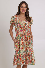 Model Madeline wearing size 10 of the Kiara Pocket Dress in colour Floral, from the front, cropped image