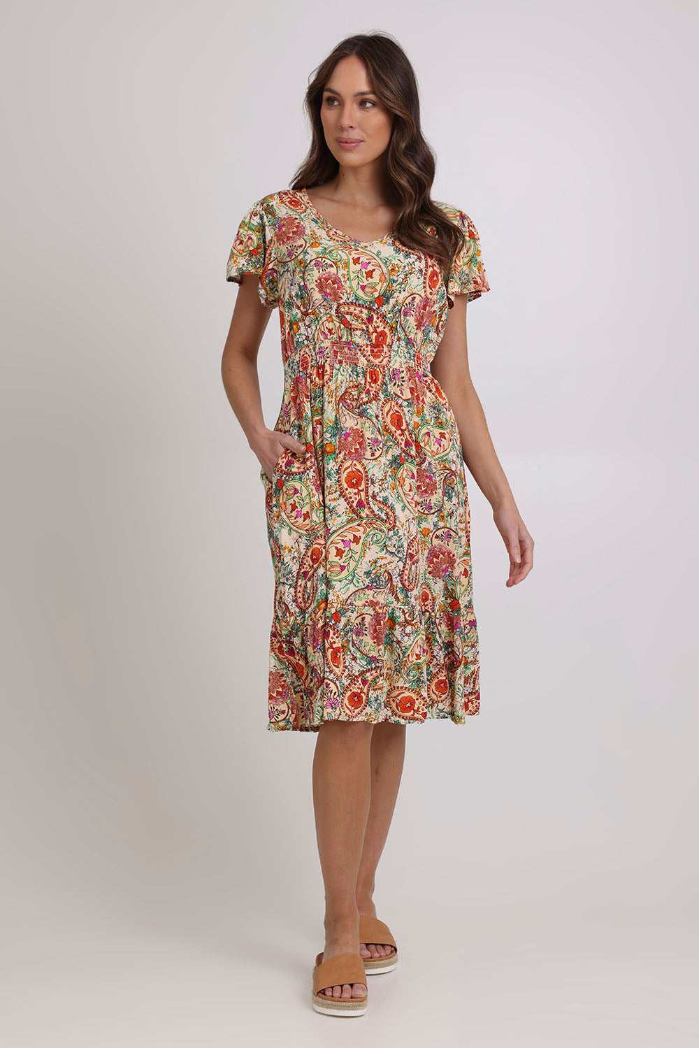 Model Madeline wearing size 10 of the Kiara Pocket Dress in colour Floral, from the front, showing the whole outfit