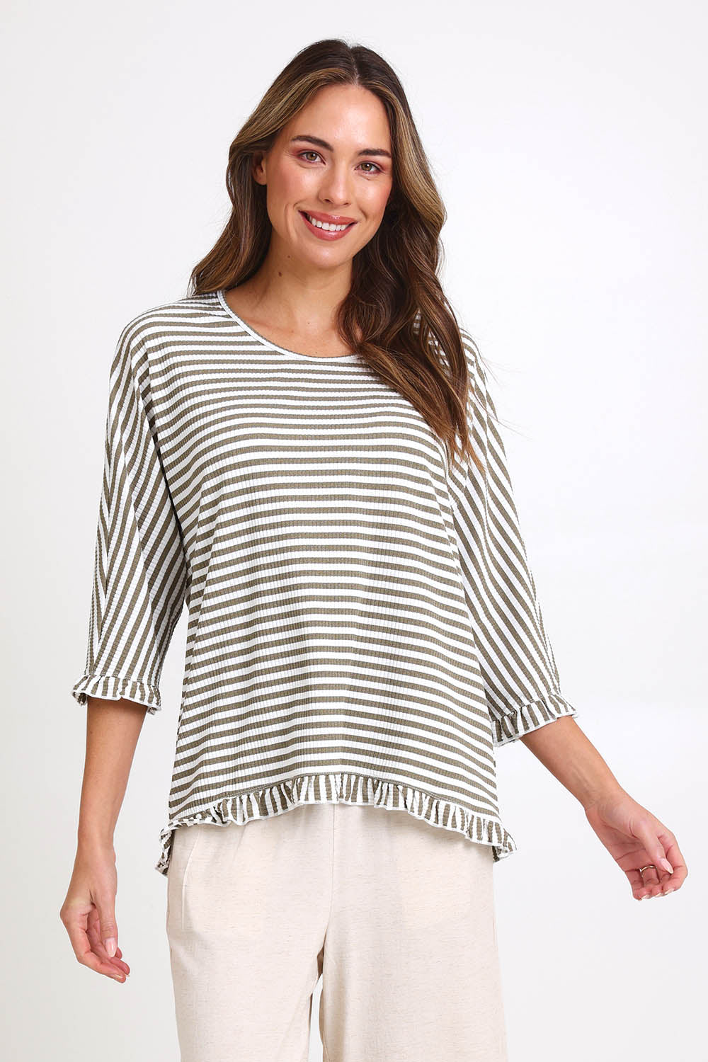 Model Madelinec wearing size 10 of the Stripe Ruffle Top – Bark in colour Bark, in a cropped view