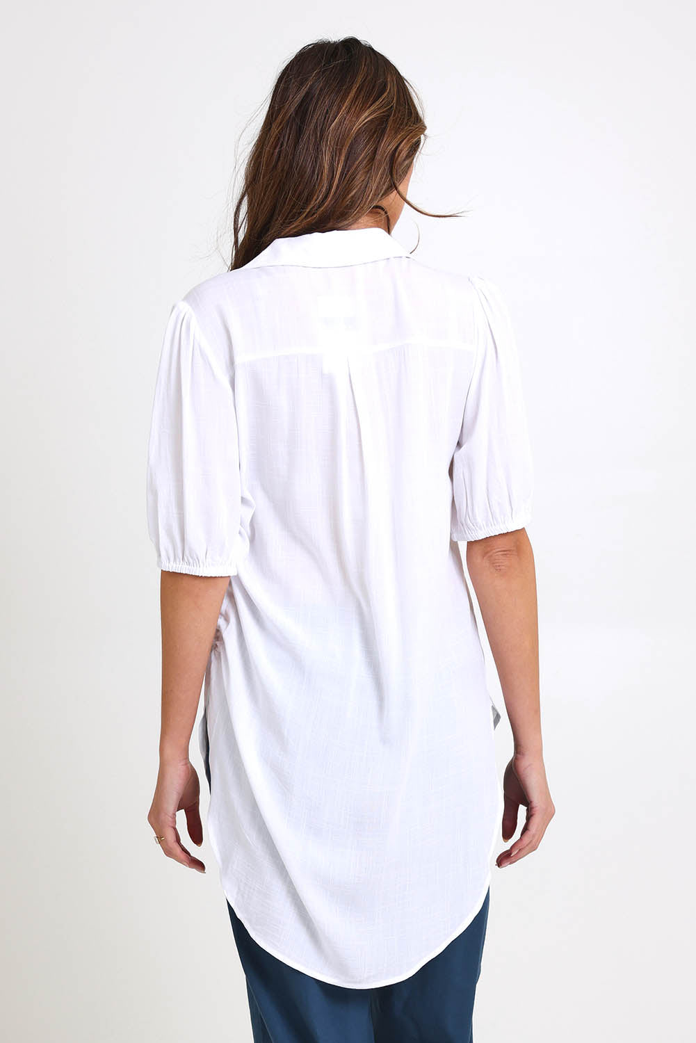 Model Madelinec wearing size 10 of the Drawstring Tunic Shirt – White in colour White, from the back