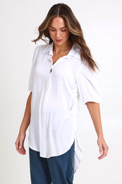 Model Madelinec wearing size 10 of the Drawstring Tunic Shirt – White in colour White, in a cropped view