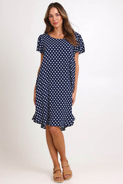 Model Madelinec wearing size 10 of the Flutter Swing Dress – Navywhite in colour Navywhite, from the front