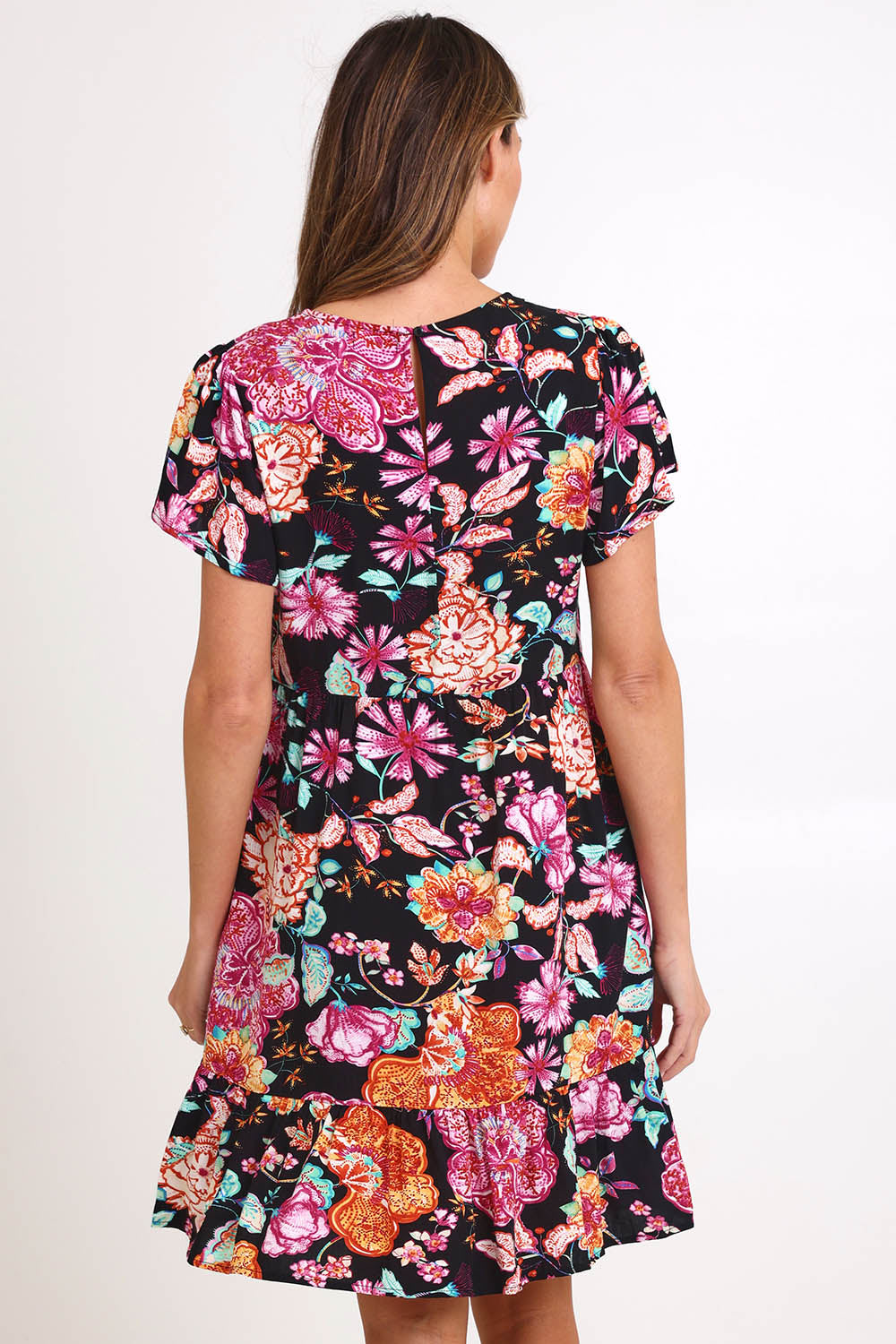 Model Madelinec wearing size 10 of the Heatwave Dress – Black in colour Black, from the back