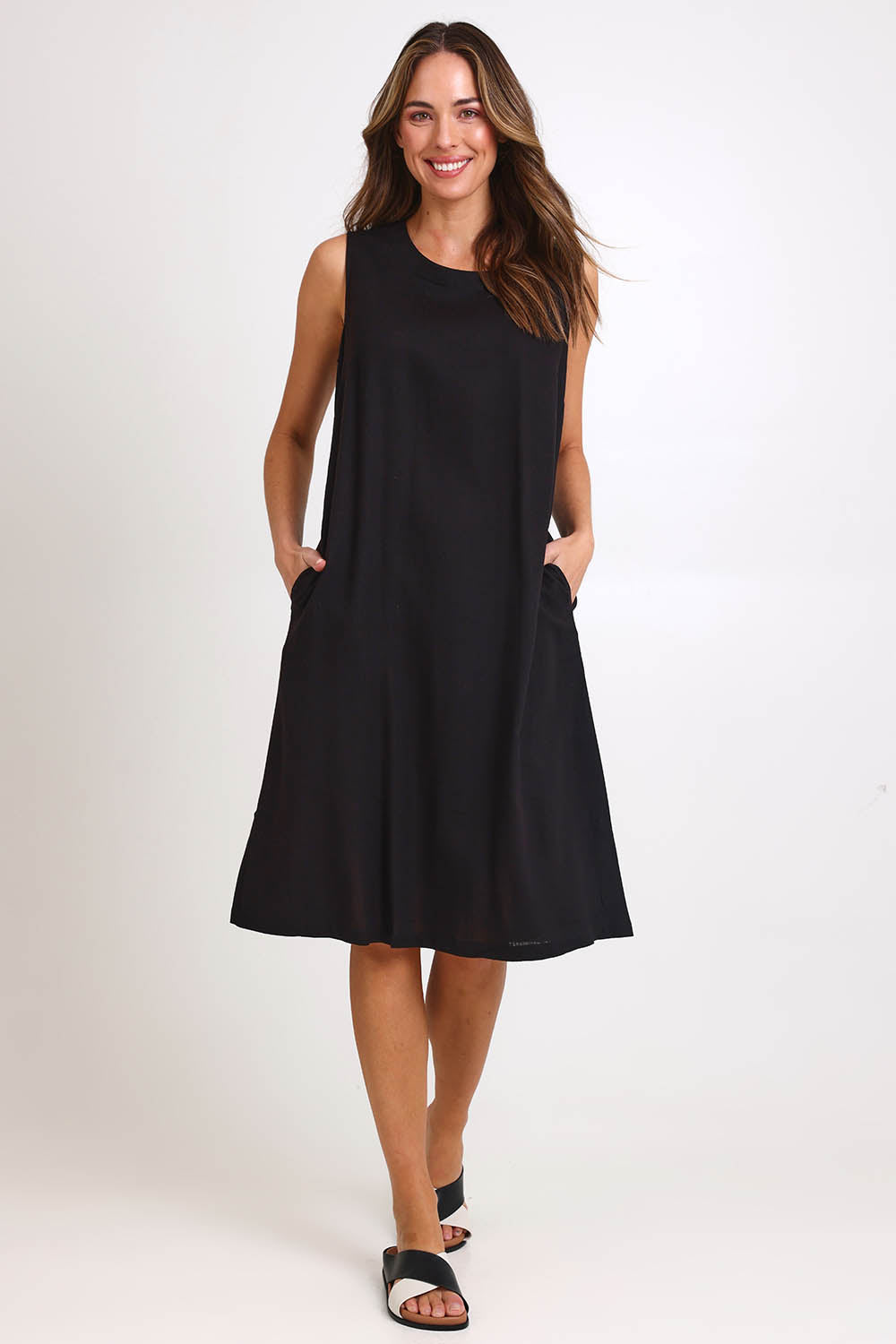 Model Madelinec wearing size 10 of the Linen Shift Dress – Black in colour Black, from the front