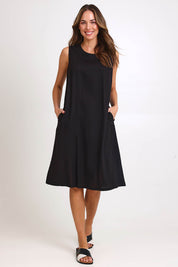 Model Madelinec wearing size 10 of the Linen Shift Dress – Black in colour Black, from the front