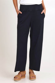 Model Madelinec wearing size 10 of the Walk And Work Pant – Black in colour Black, in a cropped view