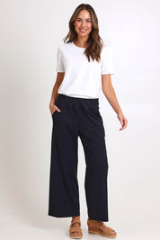 Model Madelinec wearing size 10 of the Walk And Work Pant – Black in colour Black, from the front