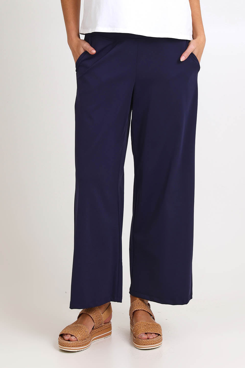 Model Madelinec wearing size 10 of the Walk And Work Pant – Navy in colour Navy, in a cropped view