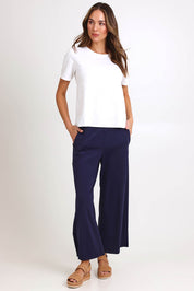 Model Madelinec wearing size 10 of the Walk And Work Pant – Navy in colour Navy, from the front