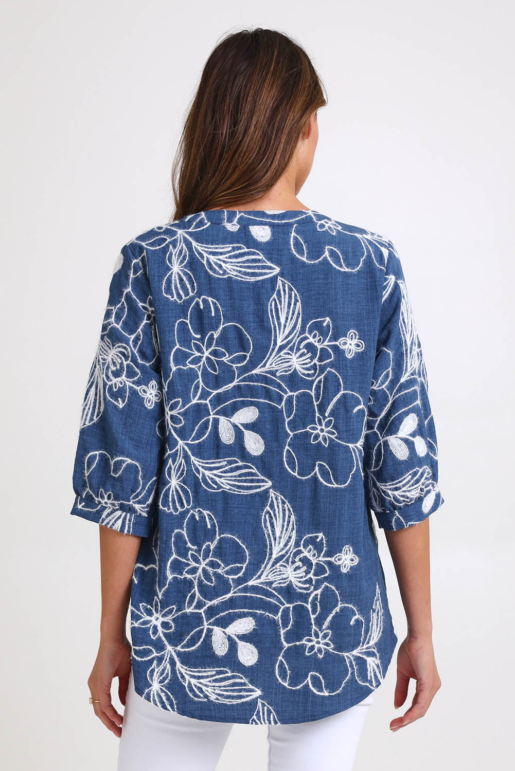 Model Madelinec wearing size 10 of the Embroidered Button Top – Blue in colour Blue, from the back
