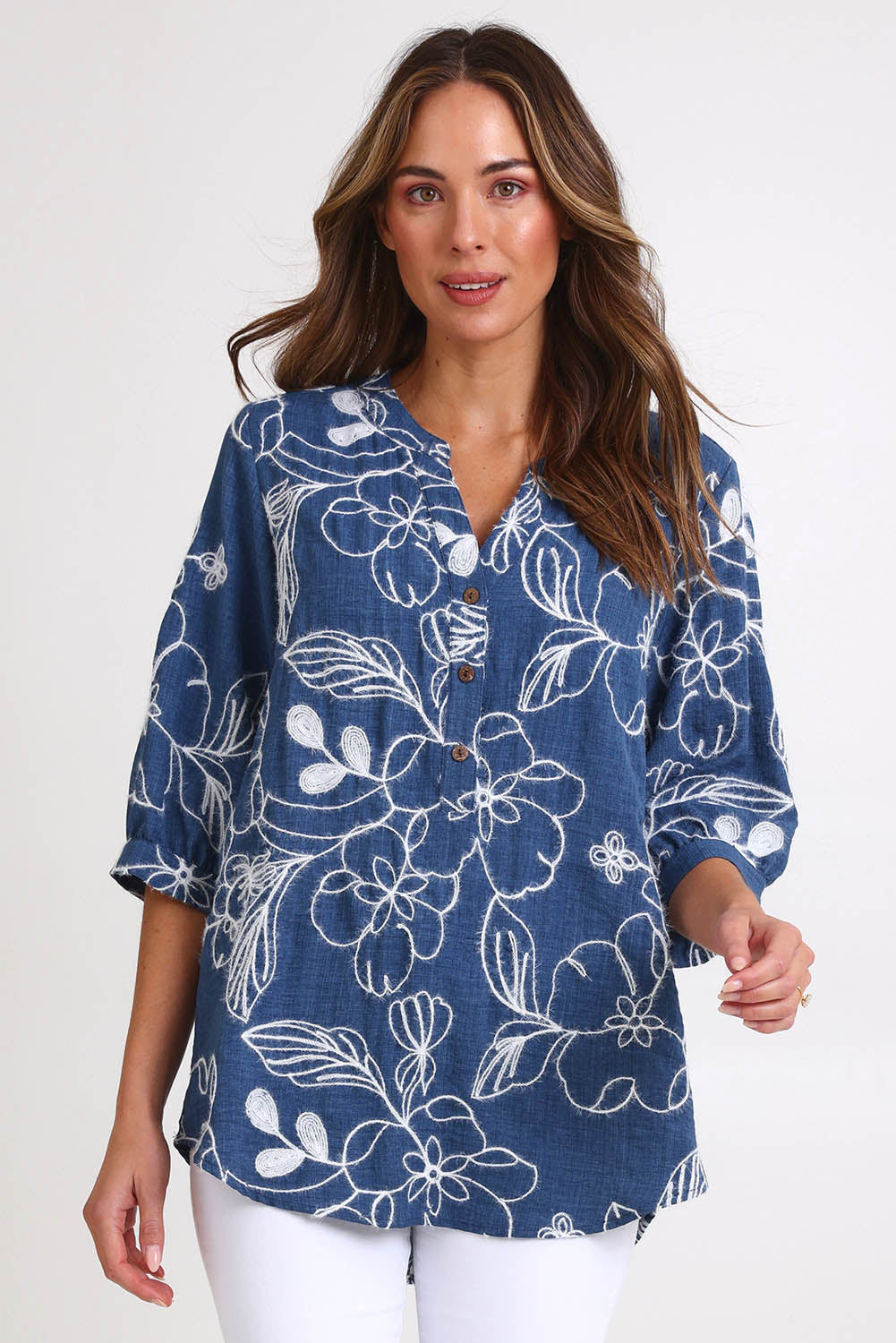 Model Madelinec wearing size 10 of the Embroidered Button Top – Blue in colour Blue, in a cropped view