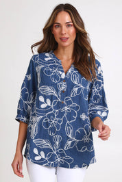 Model Madelinec wearing size 10 of the Embroidered Button Top – Blue in colour Blue, in a cropped view