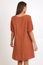 Model Madelinec wearing size 10 of the Core Linen V Shift Dress – Cinnamon in colour Cinnamon, from the back