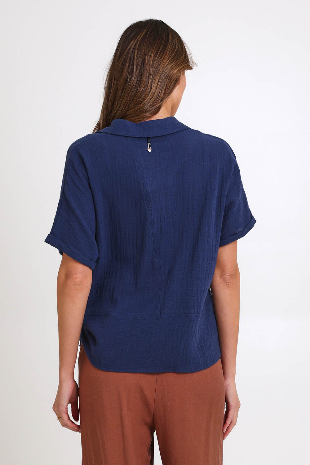 Model Madelinec wearing size 10 of the Core Wrap Over Top – Navy in colour Navy, from the back