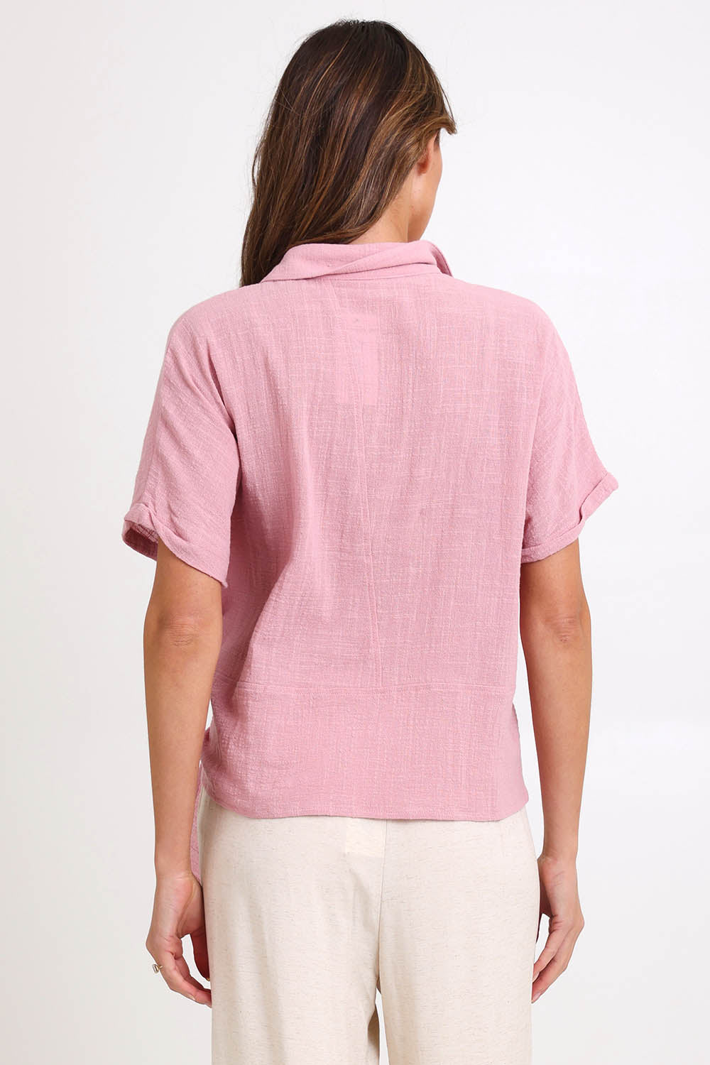Model Madelinec wearing size 10 of the Core Wrap Over Top – Rose in colour Rose, from the back