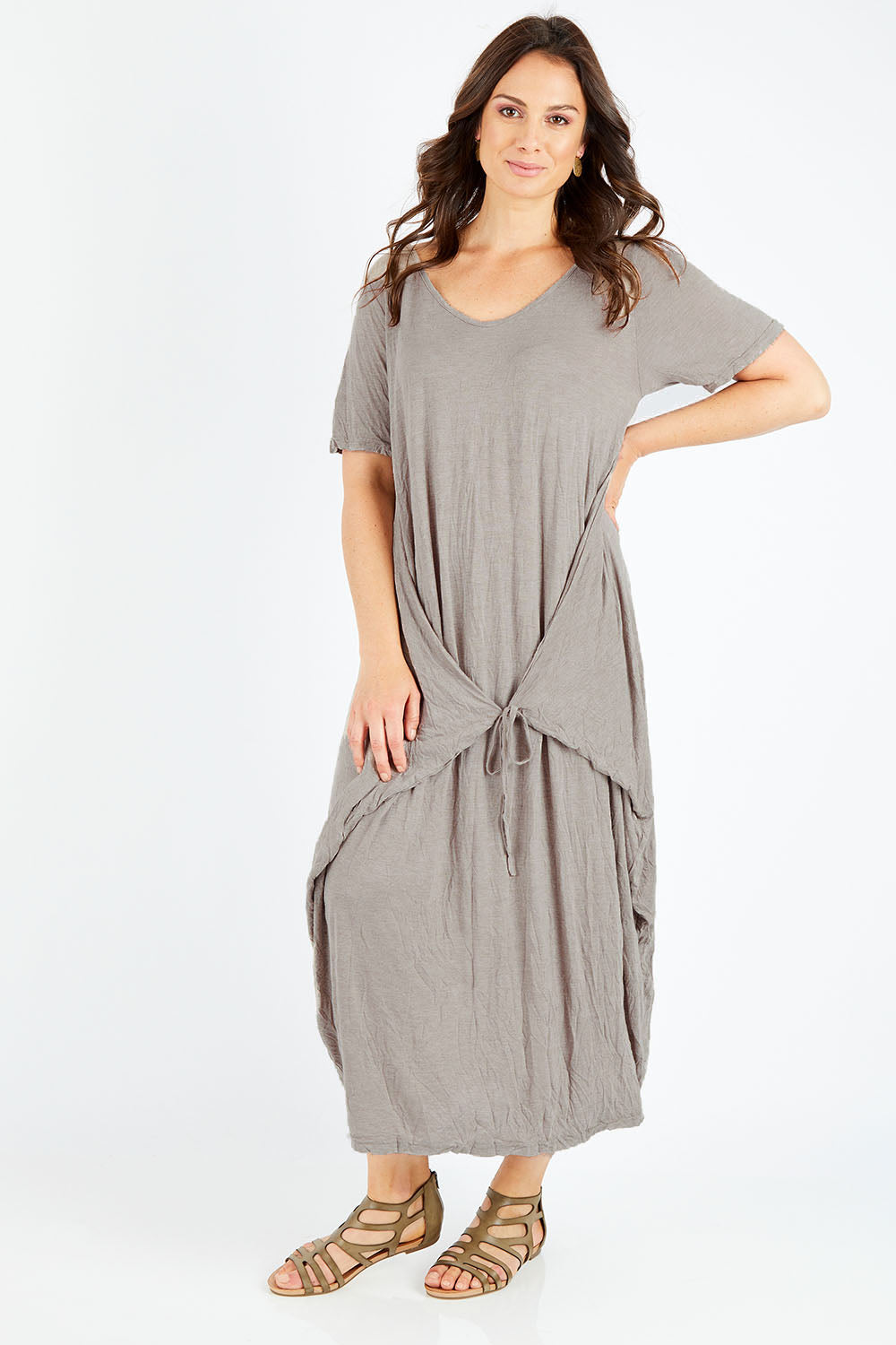 Model Shadae wearing size S-M of the Primrose Dress in colour Oatmeal, from the front, showing the whole outfit