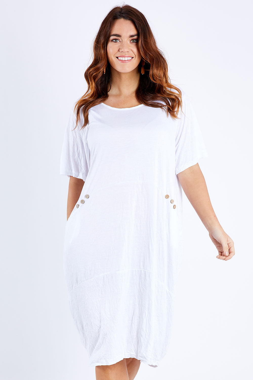 Model Laura wearing size M-L of the Happy Petals Bounce Dress in colour White (White), from the front, cropped image