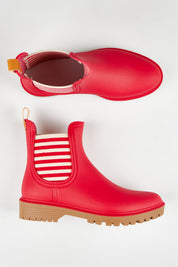 A model wearing size 37 of the Laurina2 Gumboot in colour Rubystripe (Red), from the front, showing the whole outfit