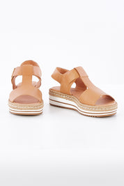 A model wearing size 38 of the Ambers Sandal Flatform in colour Tan, from the front, showing the whole outfit