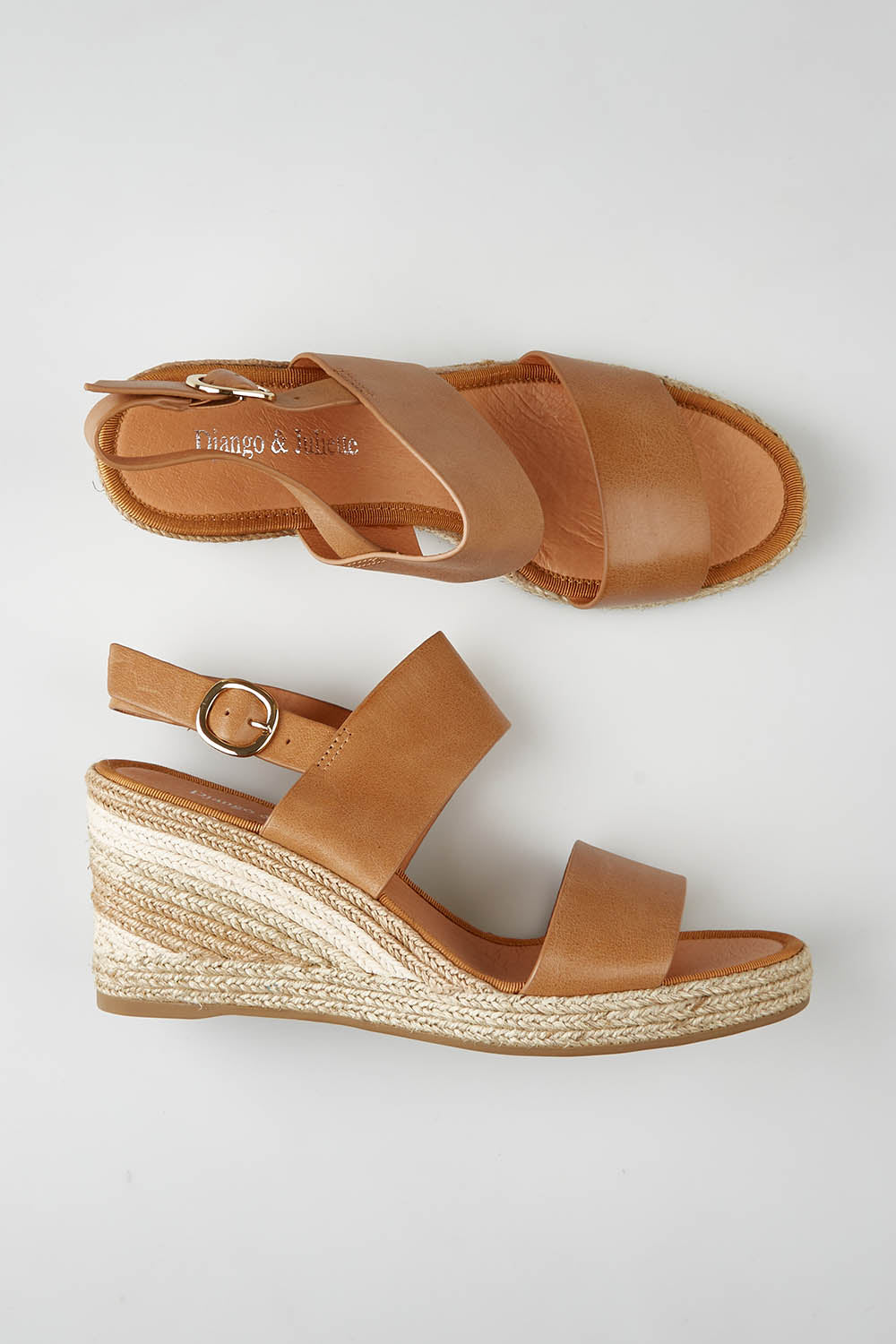 A model wearing size 37 of the Pama Leather Wedge in colour Tan, from the front, showing the whole outfit