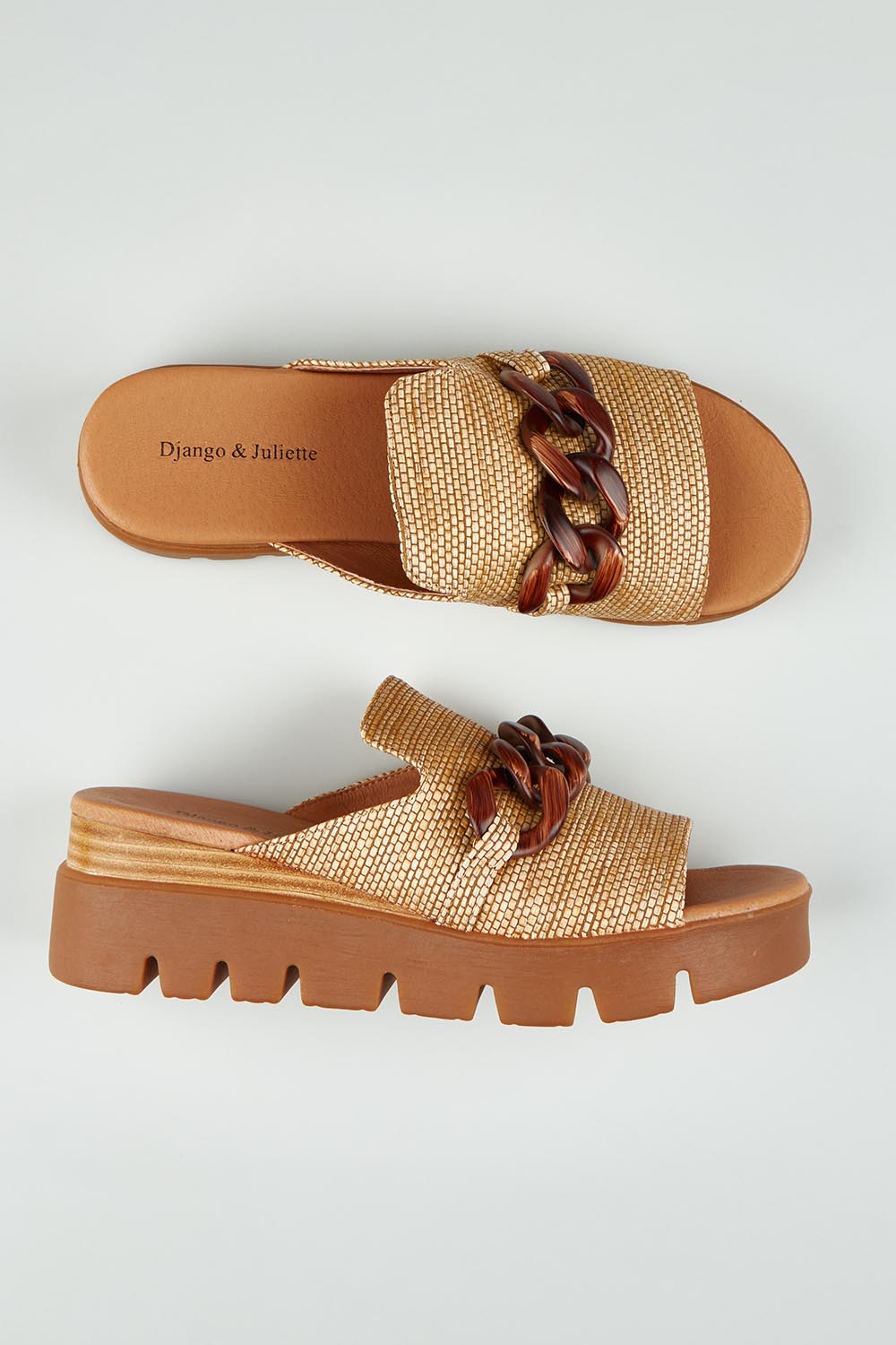 A model wearing size 37 of the Riley Raffia Wedge in colour Coffee, from the front, showing the whole outfit