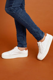 Model Sandy wearing size 40 of the Shia Leather Pull On Sneaker in colour Whitescotc (White), from the front, cropped image