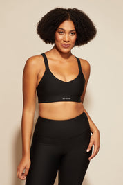 A model wearing the Say Something Crop in colour Black (Black), from the front, cropped image