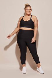 A model wearing the Say Something Crop in colour Black (Black), from the front, showing the whole outfit