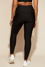 A model wearing the Elite Tight Full Length in colour Black (Black), from the back