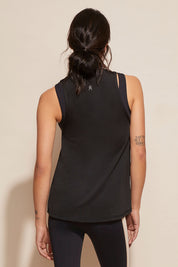 A model wearing the Worldwide Tank in colour Black (Black), from the back