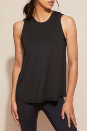 A model wearing the Worldwide Tank in colour Black (Black), from the front, cropped image