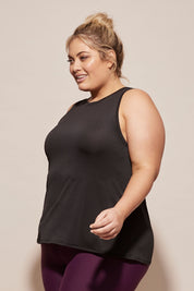 A model wearing the Worldwide Tank in colour Black (Black), from the front, cropped image