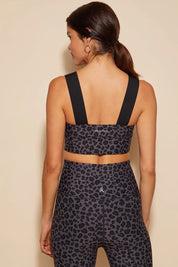 A model wearing the Antidote Crop in colour Leopardsmk (Grey), from the back